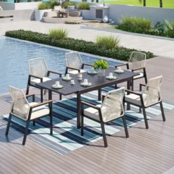 Captiva Designs 7pc Patio Dining Slat-top Steel Table & Beige Rattan Chairs With Cushions